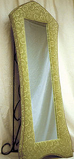 This velvet upholstered mirror is a Bella exclusive & a COM item.